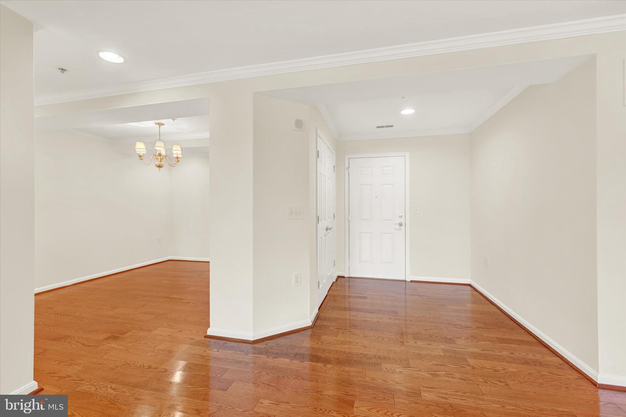 12236 Roundwood Road, Unit 104 Lutherville-Timonium, MD 21093 - Photo 3 of 27 a view of a room with wooden floor