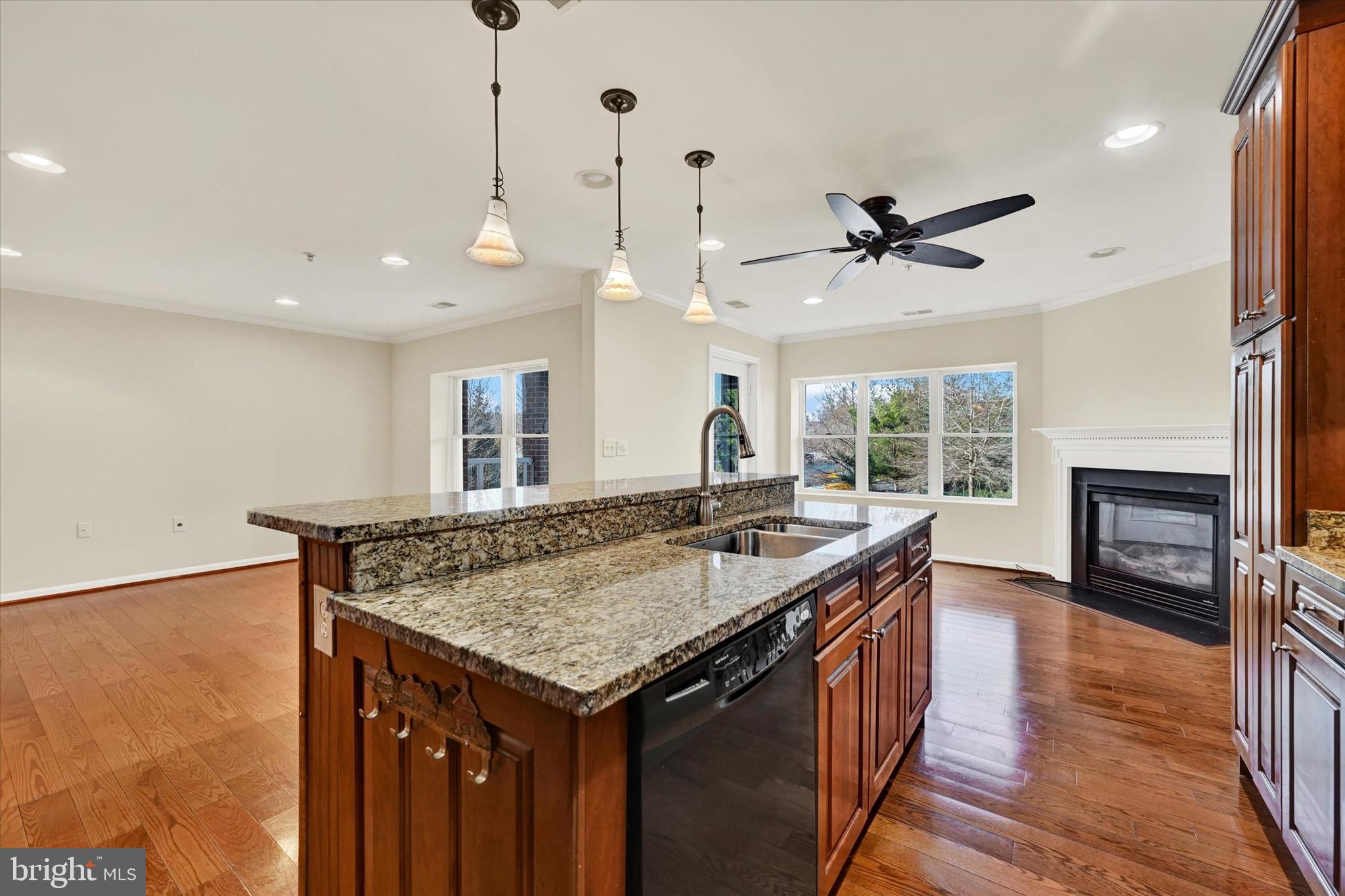 12236 Roundwood Road, Unit 104 Lutherville-Timonium, MD 21093 - Photo 10 of 27 a kitchen with a stove and a wooden floor