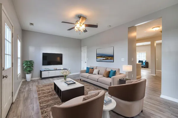 a living room with furniture and a flat screen tv