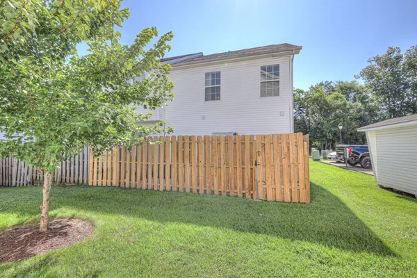 a backyard of a house with a garden and deck