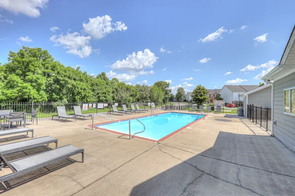 a view of a patio with swimming pool