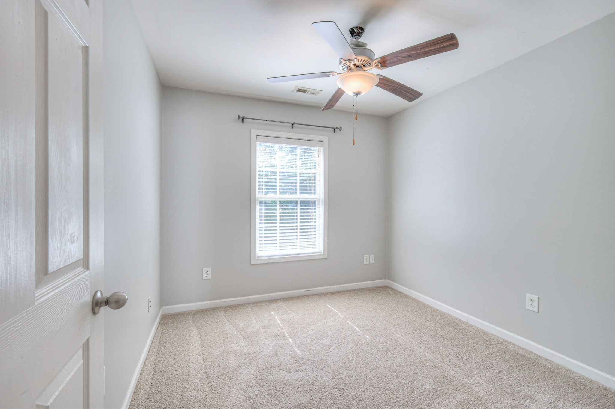 4027 Clinton Lane Spring Hill, TN 37174 - Photo 10 of 25 an empty room with windows and fan