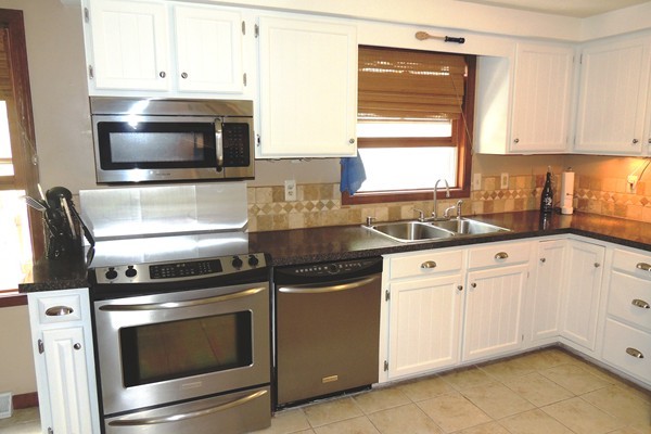 35 Zuell Hill Road Monson, MA 01057 - Photo 3 of 30 a kitchen with granite countertop white cabinets appliances and a sink