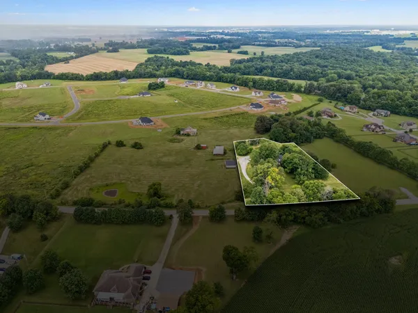 a view of a lake with a yard