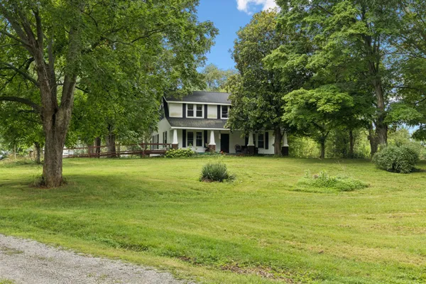 a view of a house with a big yard