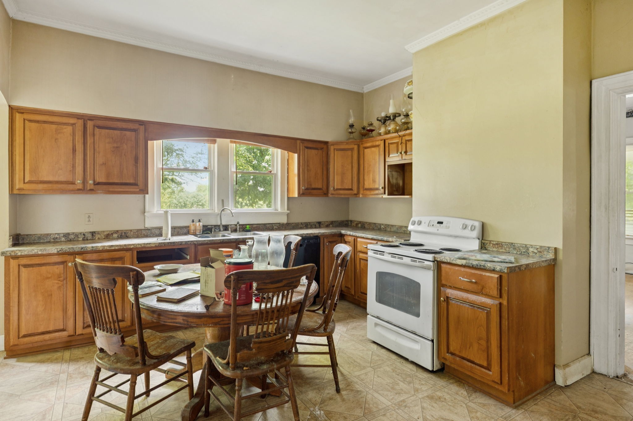 350 Port Royal Road Clarksville, TN 37040 - Photo 6 of 19 a kitchen with a stove a sink and a refrigerator