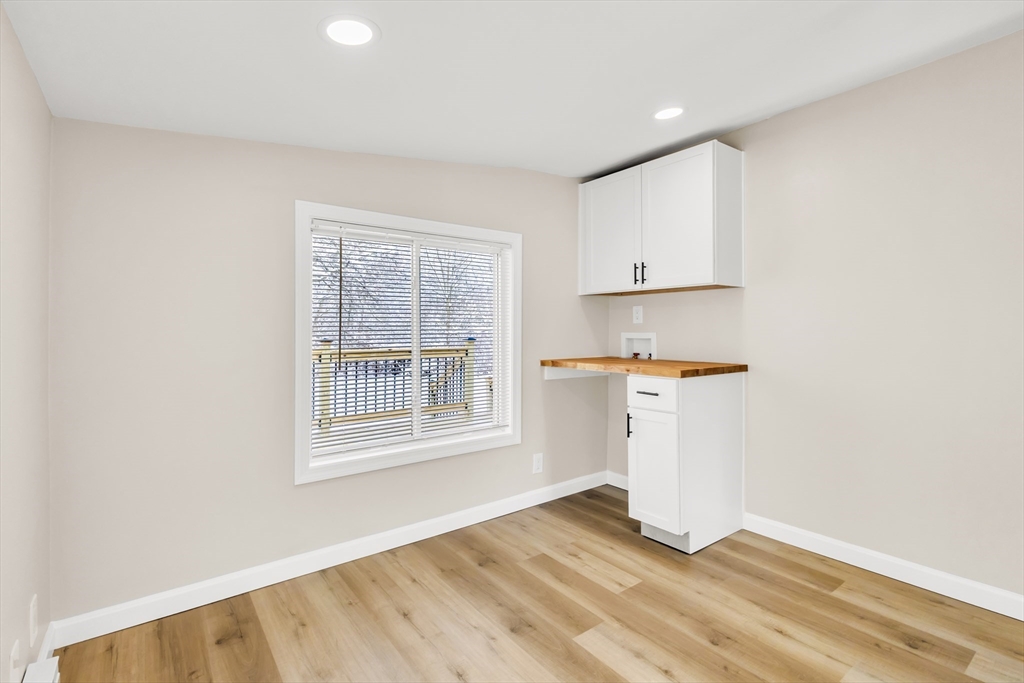 1 Columbia Road Billerica, MA 01821 - Photo 15 of 22 an empty room with wooden floor and windows