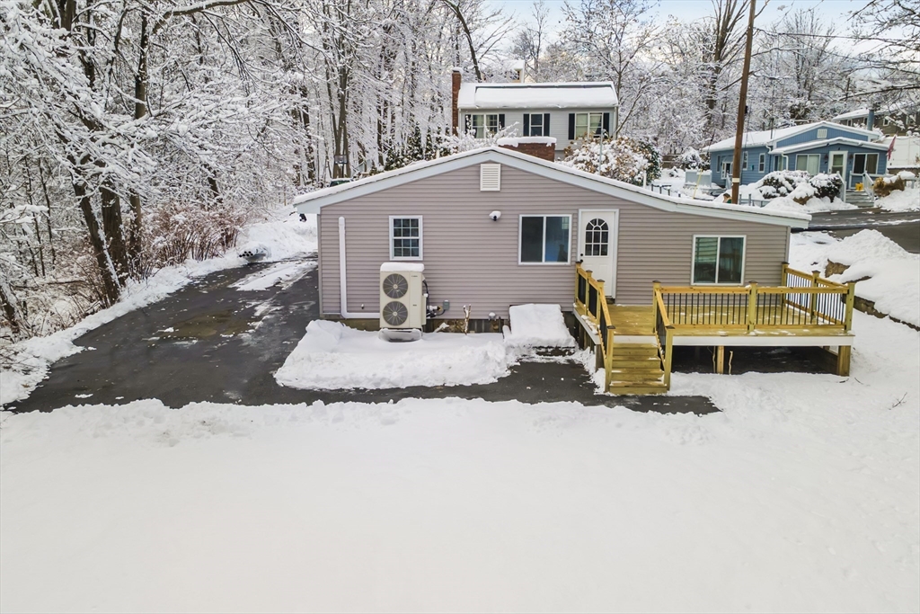 1 Columbia Road Billerica, MA 01821 - Photo 18 of 22 a view of a house with a yard covered in snow