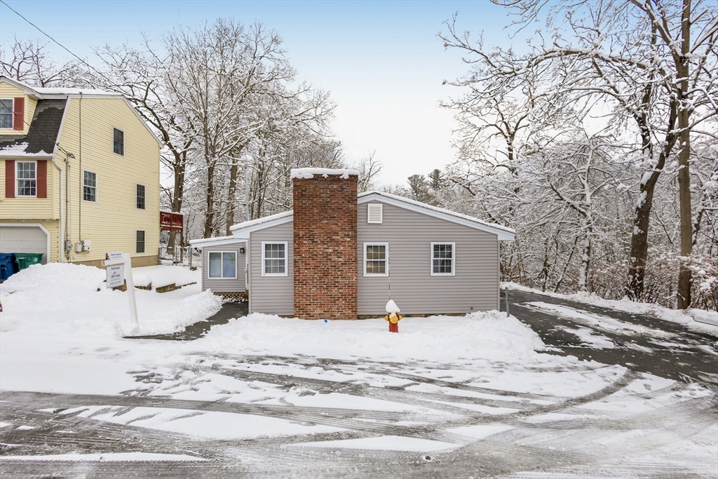 1 Columbia Road Billerica, MA 01821 - Photo 19 of 22 a view of a house with snow on the background