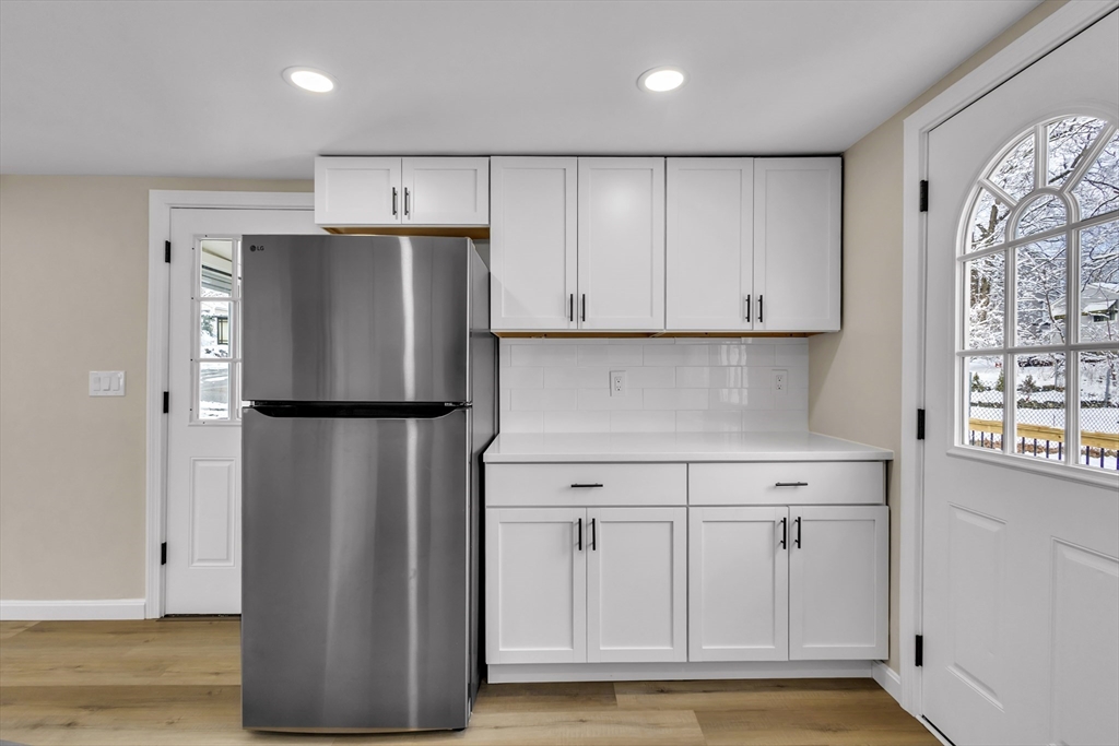 1 Columbia Road Billerica, MA 01821 - Photo 4 of 22 a kitchen with stainless steel appliances a refrigerator and a stove top oven