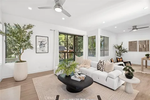 a living room with furniture and windows
