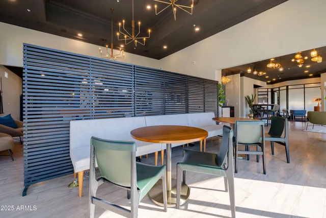 a view of a chairs and table in a patio