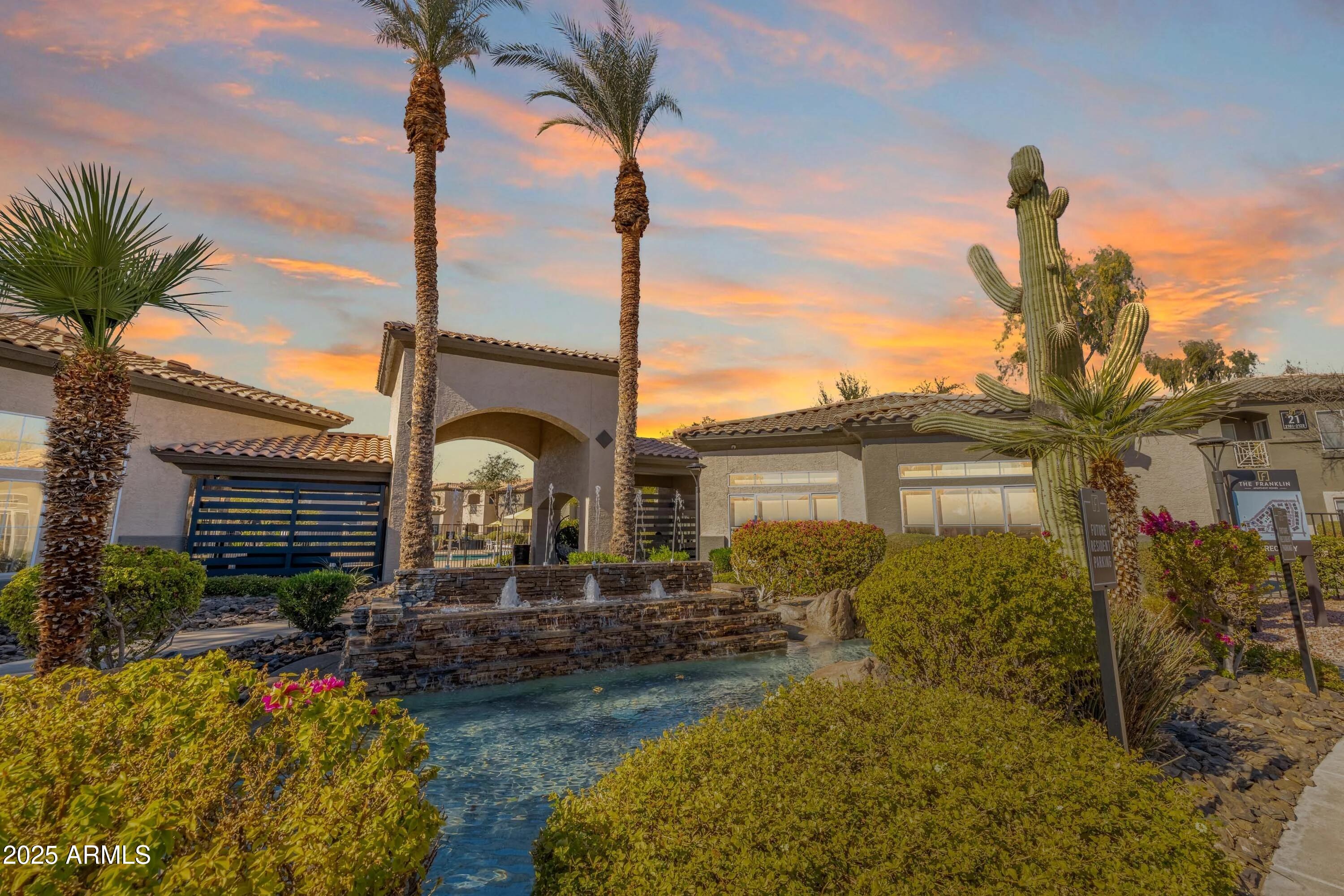 17374 North 89th Avenue, Unit C1 Peoria, AZ 85382 - Photo 21 of 22 a front view of a house with a garden and yard