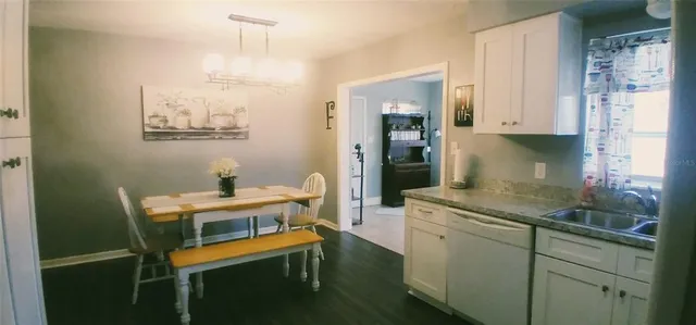 a kitchen with a sink cabinets and appliances