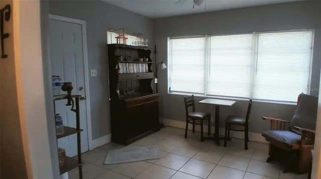 a kitchen with a window and a refrigerator