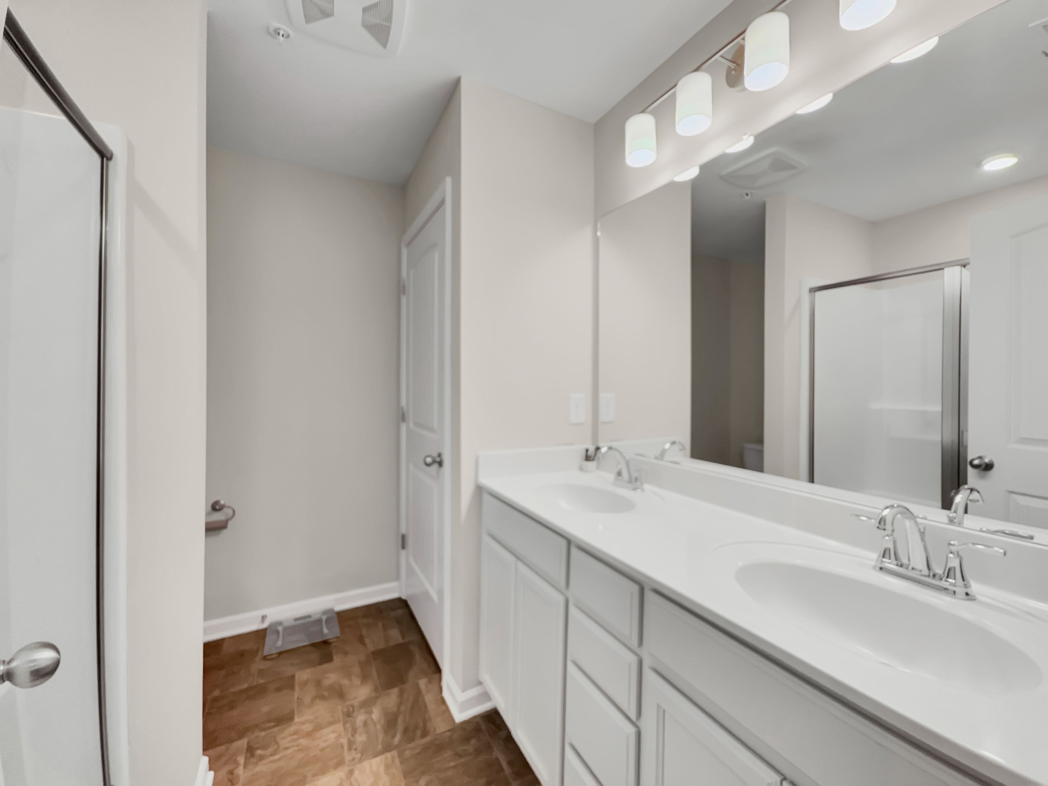 147 Addi Street Pleasant View, TN 37146 - Photo 16 of 27 a bathroom with a double vanity sink and mirror