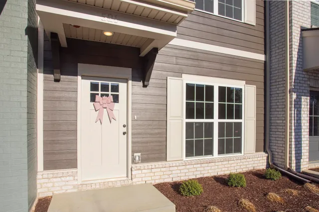 a front view of a house with a window and a door