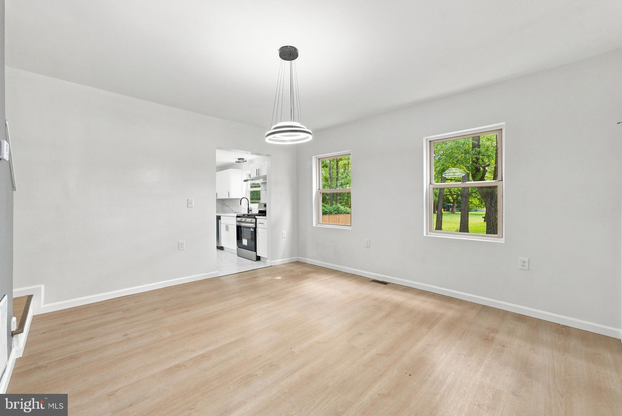 185 Rancocas Road Mount Holly, NJ 08060 - Photo 8 of 34 a view of an empty room with window and wooden floor