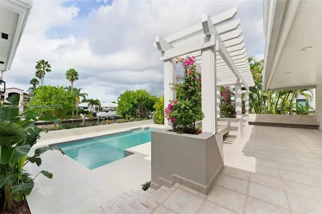 a view of swimming pool with outdoor seating