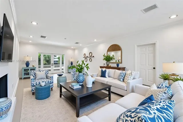 a living room with furniture fireplace and flat screen tv