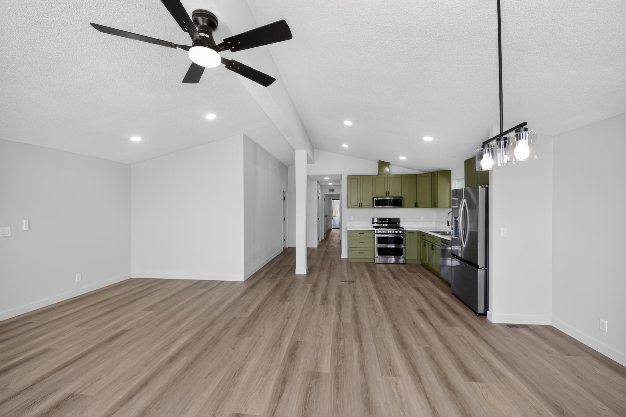 15181 Van Buren Boulevard, Unit 102 Riverside, CA 92504 - Photo 7 of 29 a view of kitchen with cabinets and wooden floor