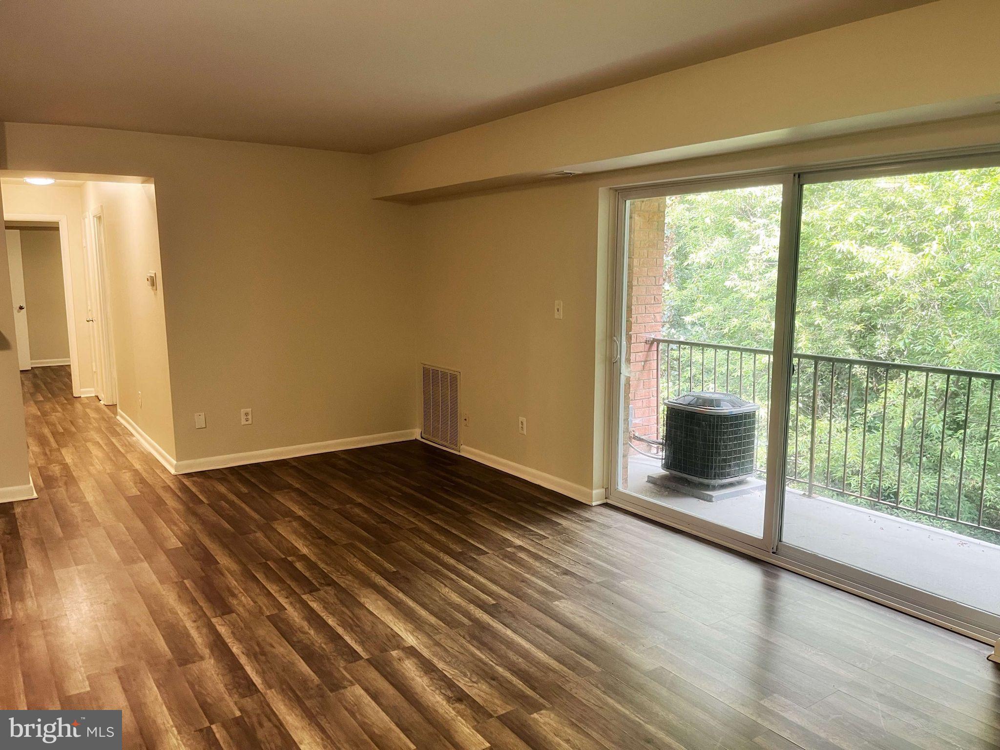 2656 Bowen Road Southeast, Unit 402 Washington, DC 20020 - Photo 3 of 10 a view of a livingroom with wooden floor