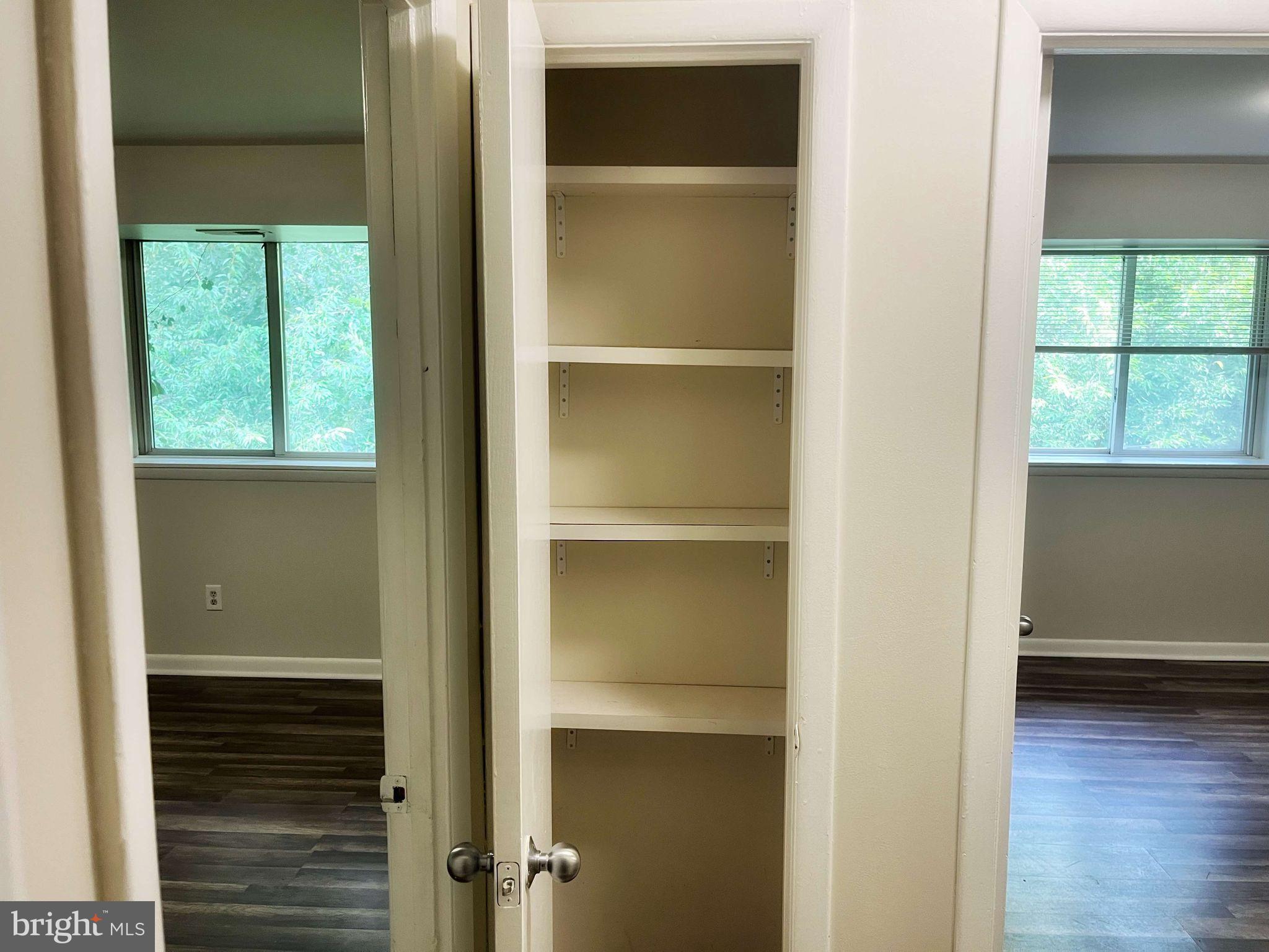 2656 Bowen Road Southeast, Unit 402 Washington, DC 20020 - Photo 6 of 10 a view of an empty room with wooden floor and a window