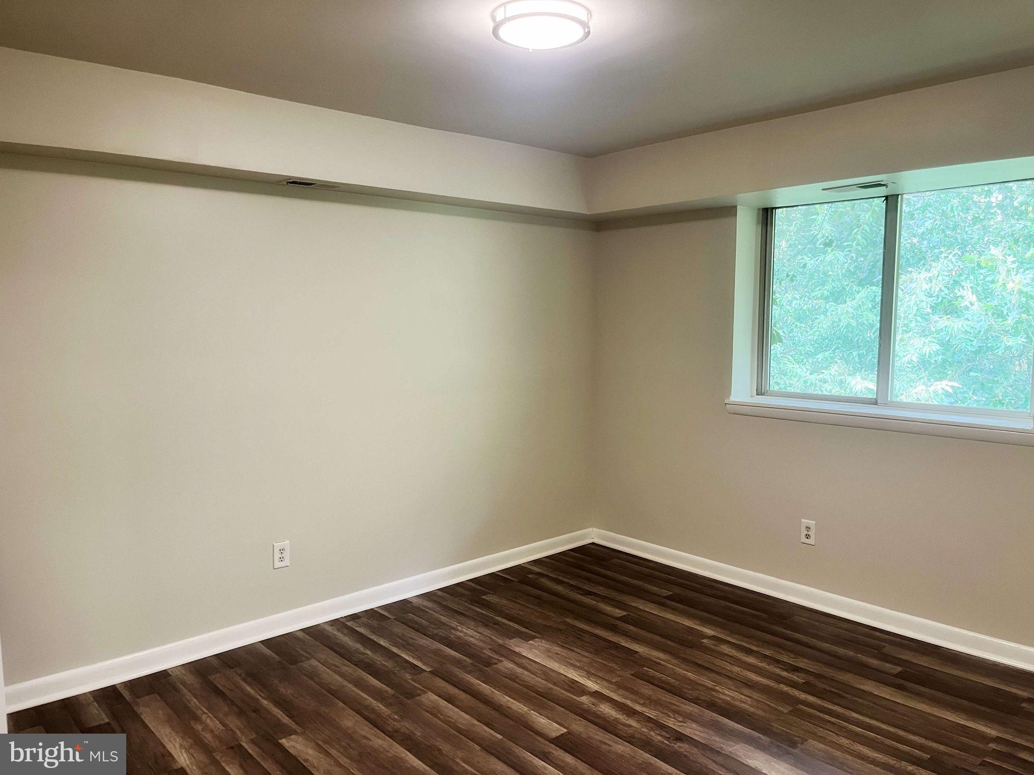2656 Bowen Road Southeast, Unit 402 Washington, DC 20020 - Photo 7 of 10 a view of a room with wooden floor and small window