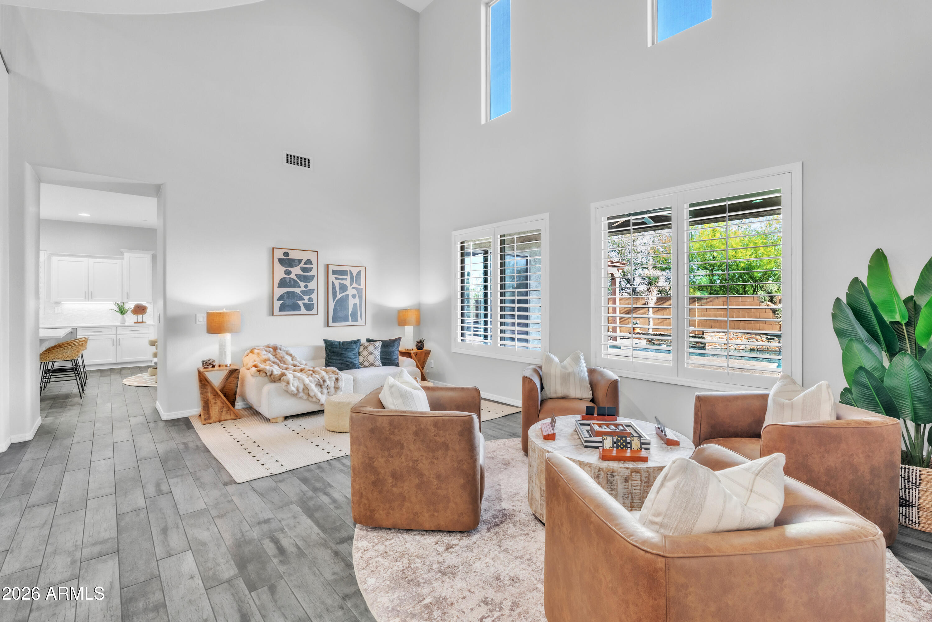 1615 West Red Fox Road Phoenix, AZ 85085 - Photo 9 of 64 a living room with furniture and a large window