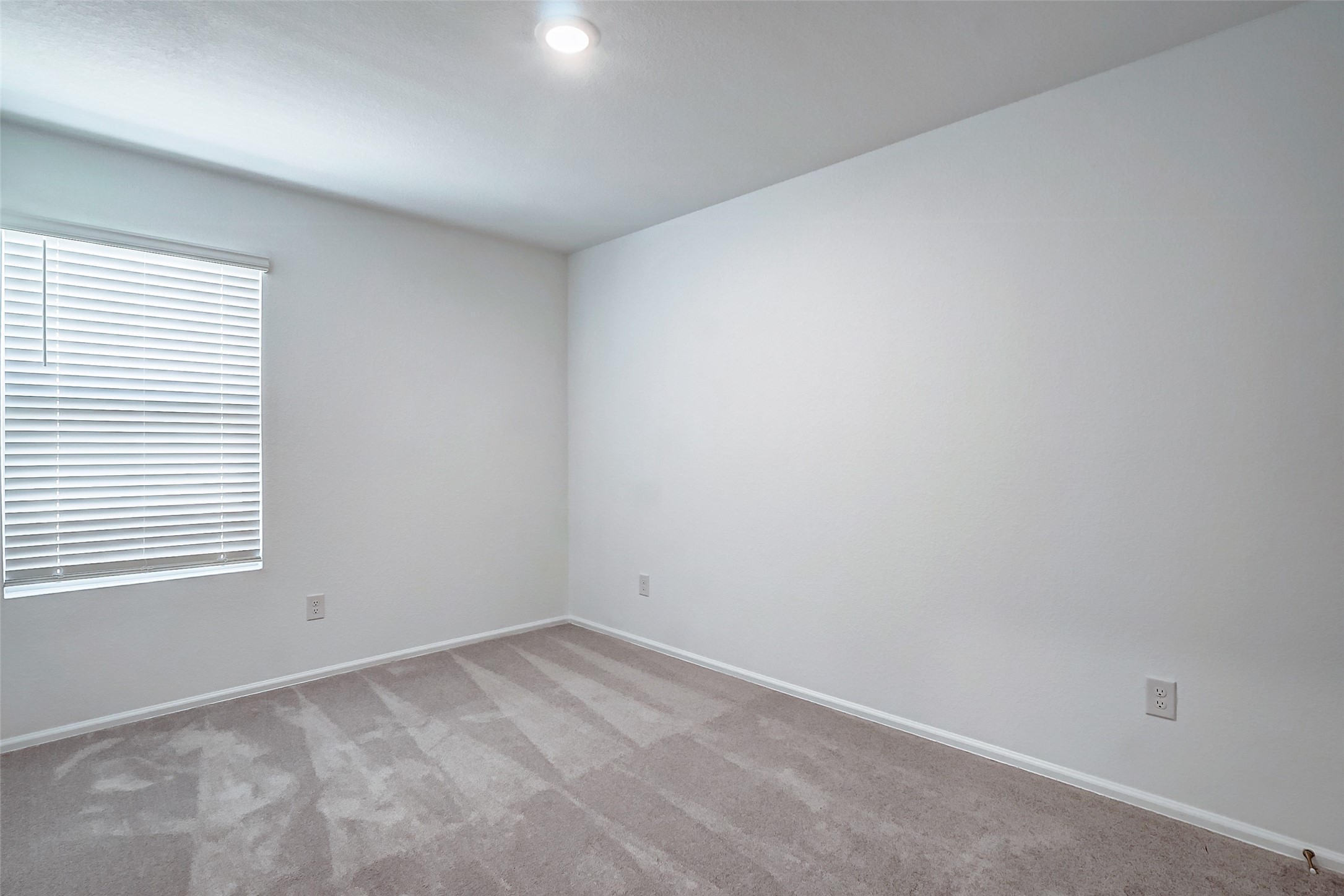 20961 Zuccala Drive New Caney, TX 77357 - Photo 13 of 33 an empty room with a window