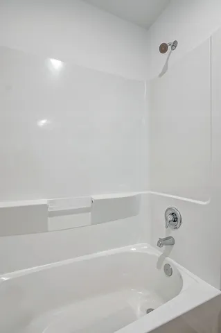 a close up of a bathtub in a bathroom