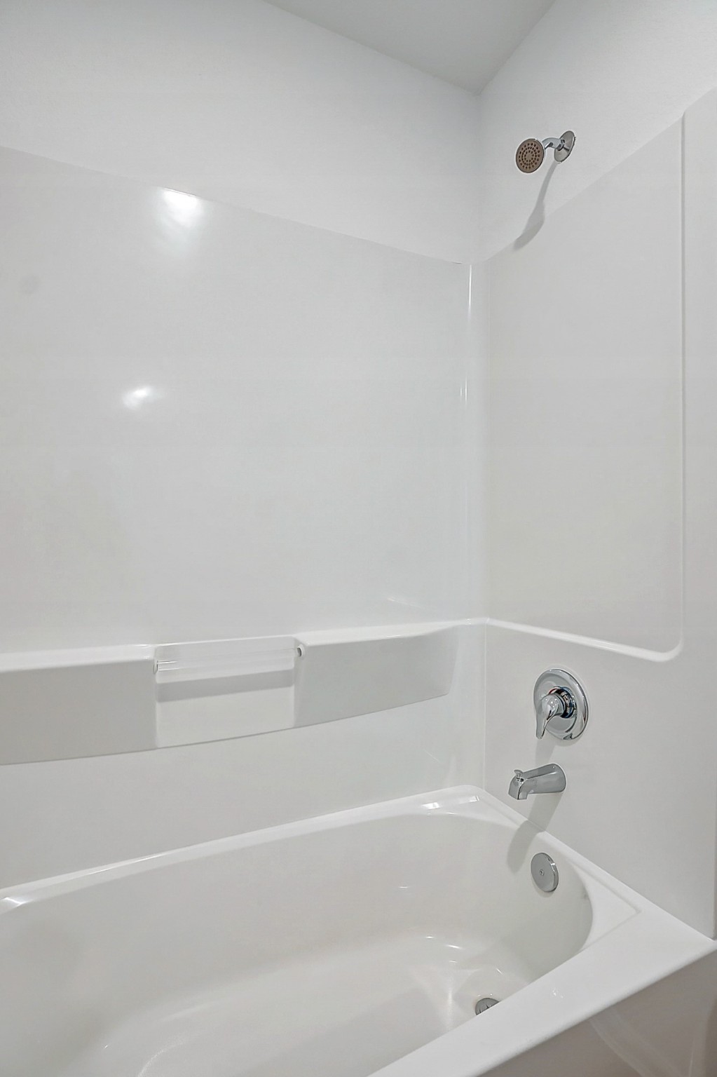 20961 Zuccala Drive New Caney, TX 77357 - Photo 15 of 33 a close up of a bathtub in a bathroom