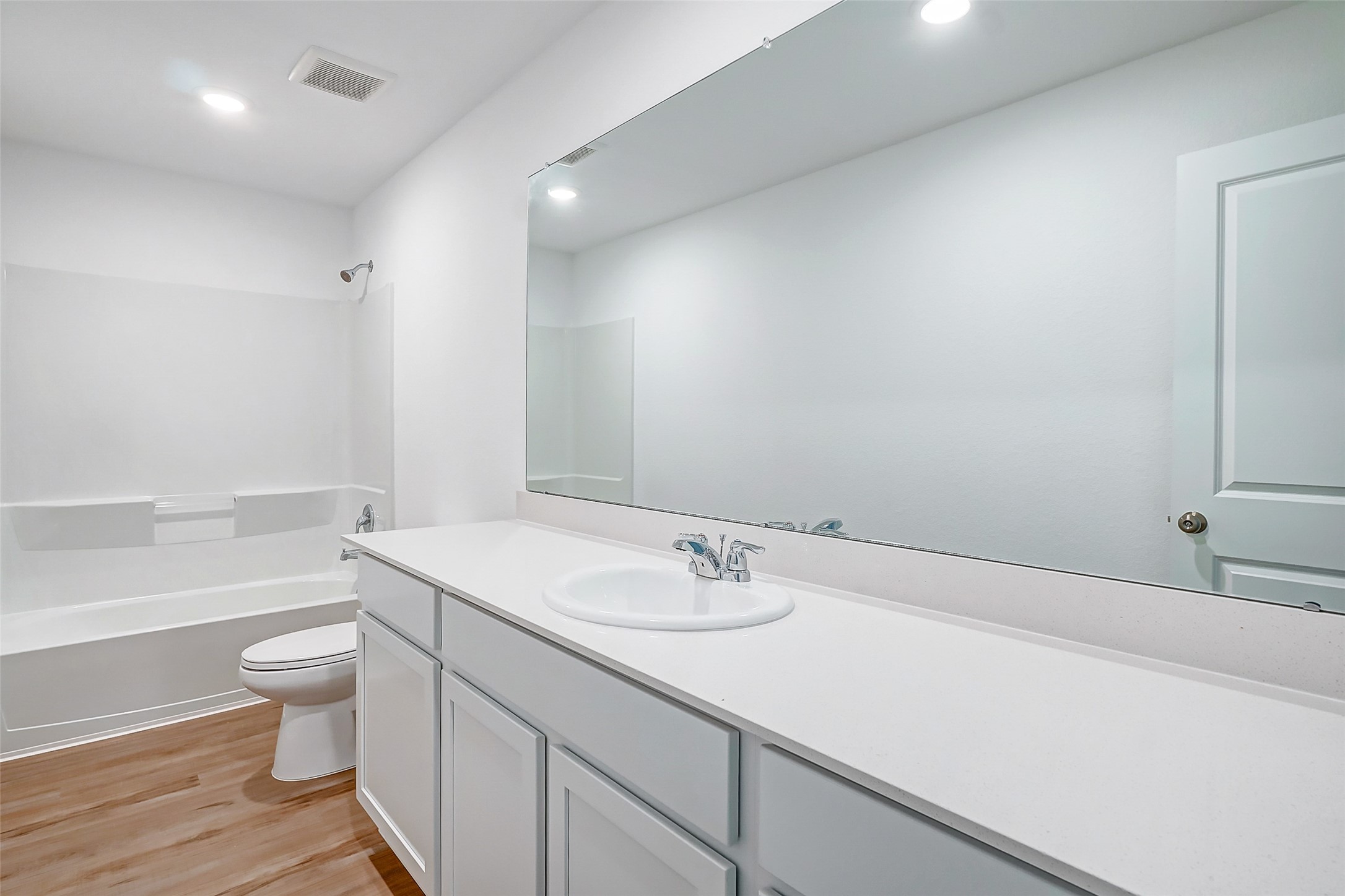 20961 Zuccala Drive New Caney, TX 77357 - Photo 16 of 33 a bathroom with a sink a toilet and shower