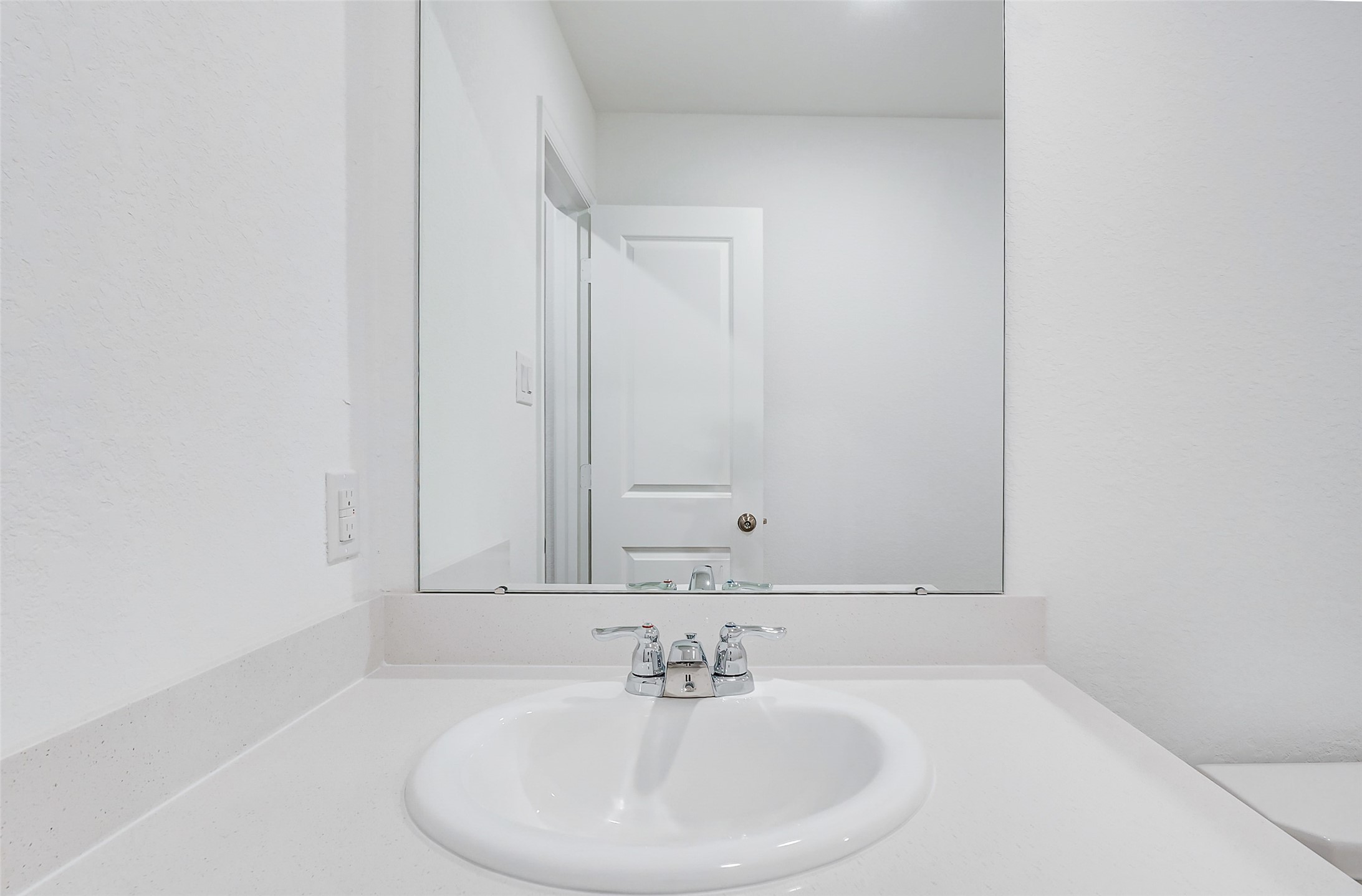 20961 Zuccala Drive New Caney, TX 77357 - Photo 21 of 33 a bathroom with a sink and a mirror