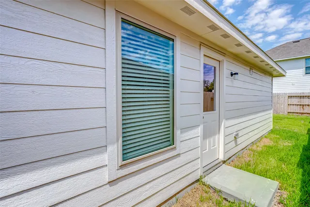 a view of a house with a large window