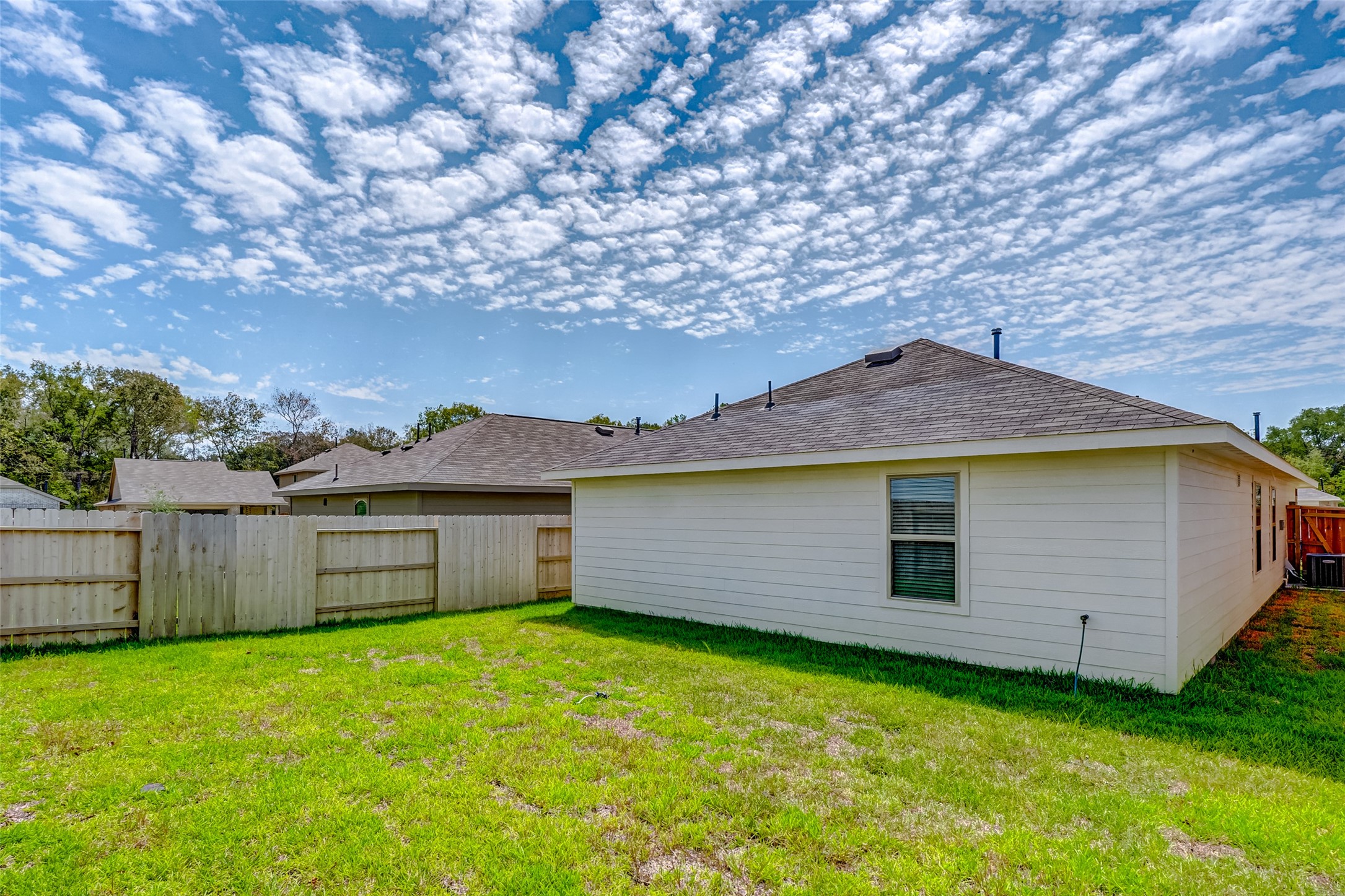 20961 Zuccala Drive New Caney, TX 77357 - Photo 24 of 33 a view of a house with a backyard