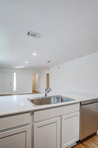 a kitchen with a sink and cabinets