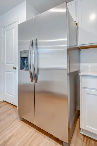 a view of a livingroom with wooden floor
