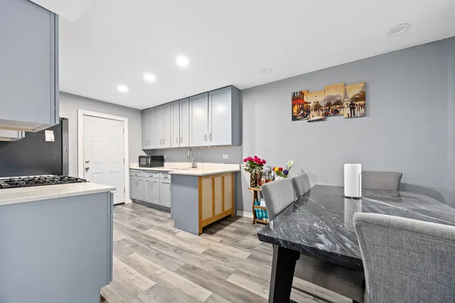 a very nice looking dining room with a table and chairs