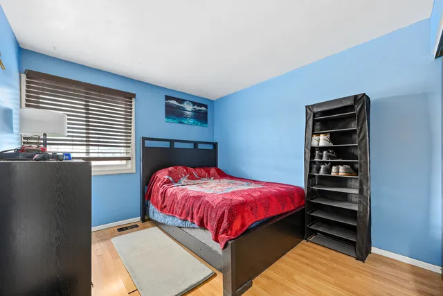 a bedroom with a bed and a closet