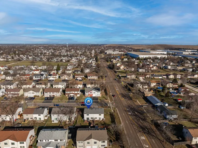 an aerial view of residential houses with outdoor space
