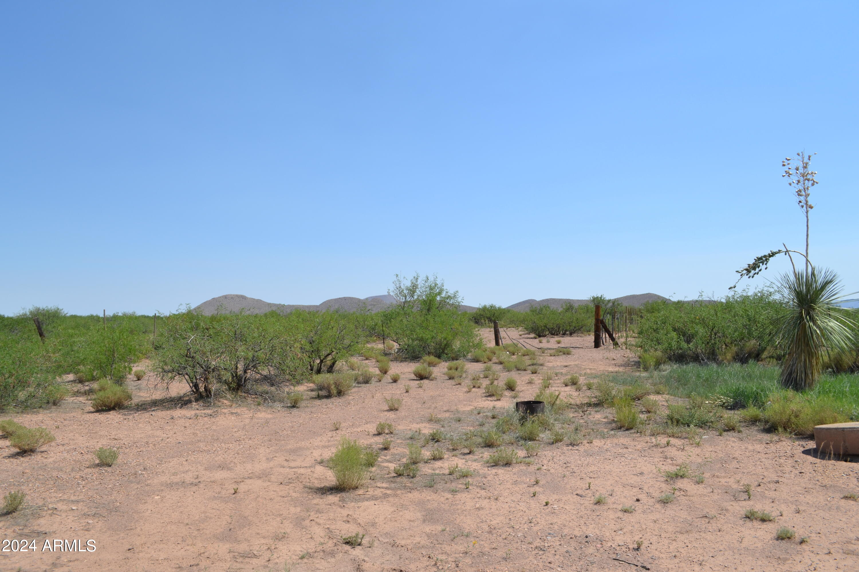 Tbd West Aqua Blanca Road Elfrida, AZ 85610 - Photo 22 of 32 a view of a road with a mountain in the background