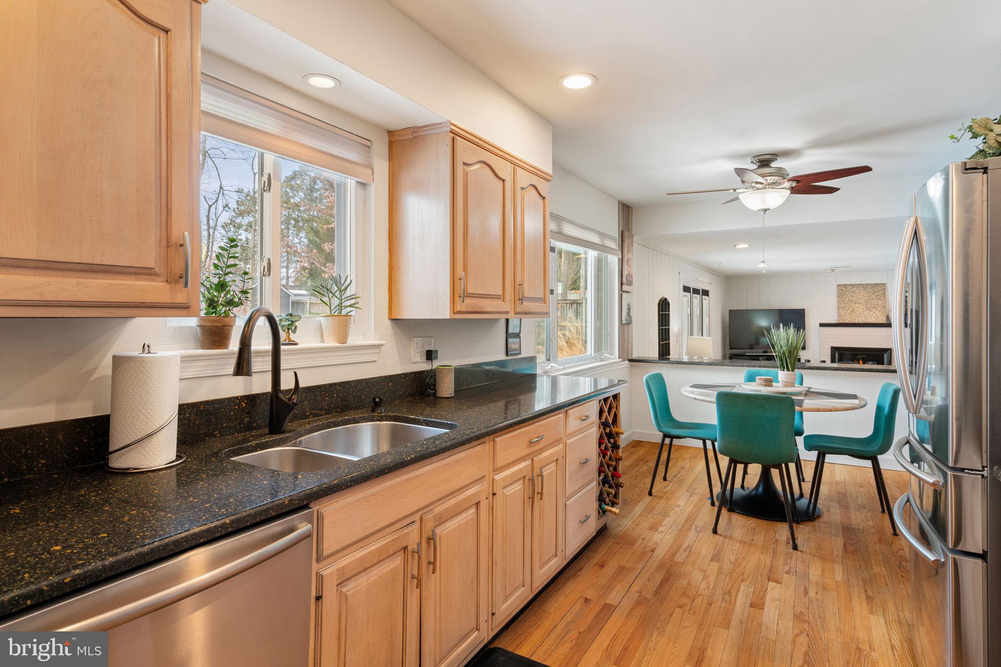 6102 Sherborn Lane Springfield, VA 22152 - Photo 15 of 51 a view of a kitchen counter space a sink and a window