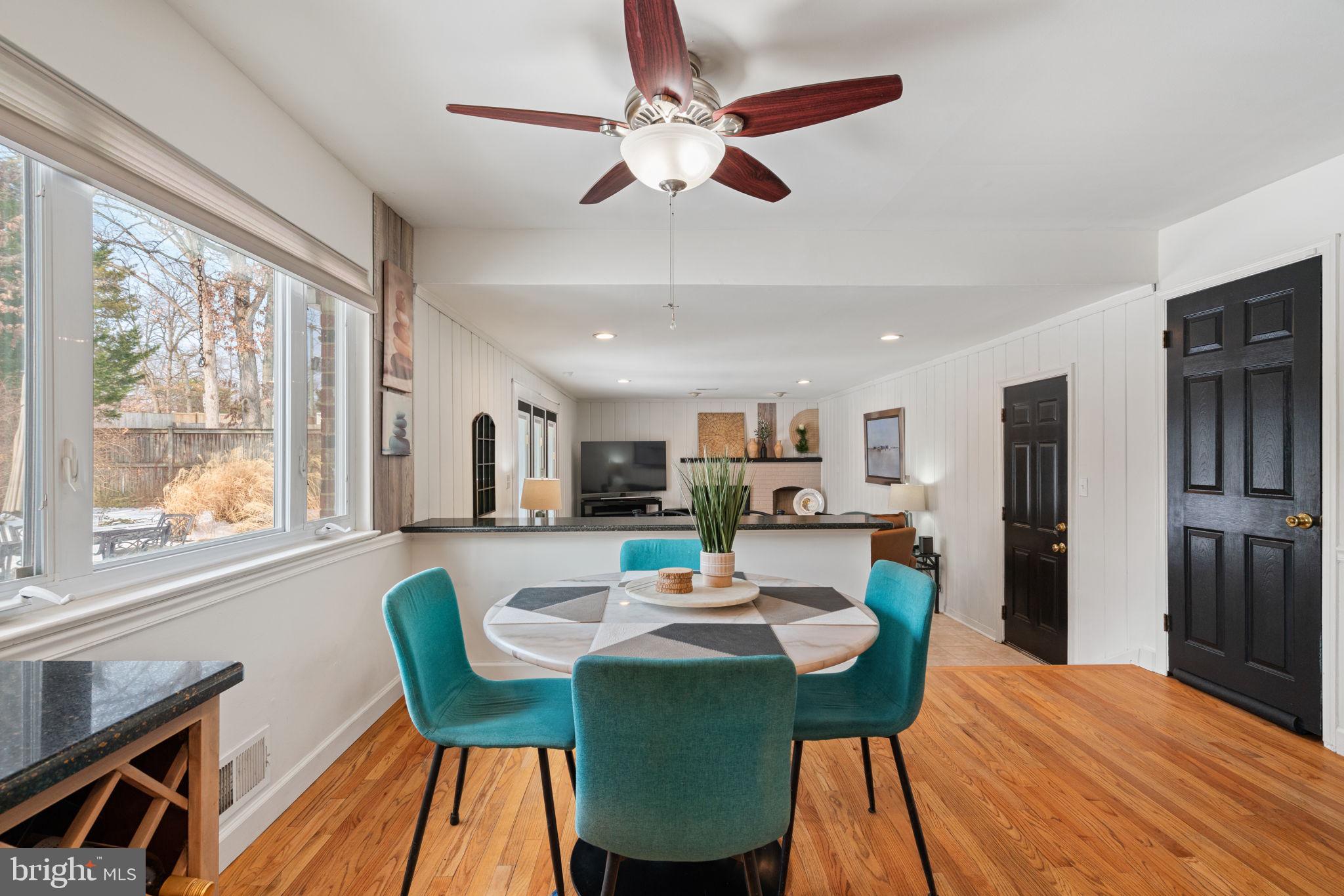 6102 Sherborn Lane Springfield, VA 22152 - Photo 19 of 51 a view of a dining room with furniture window and wooden floor