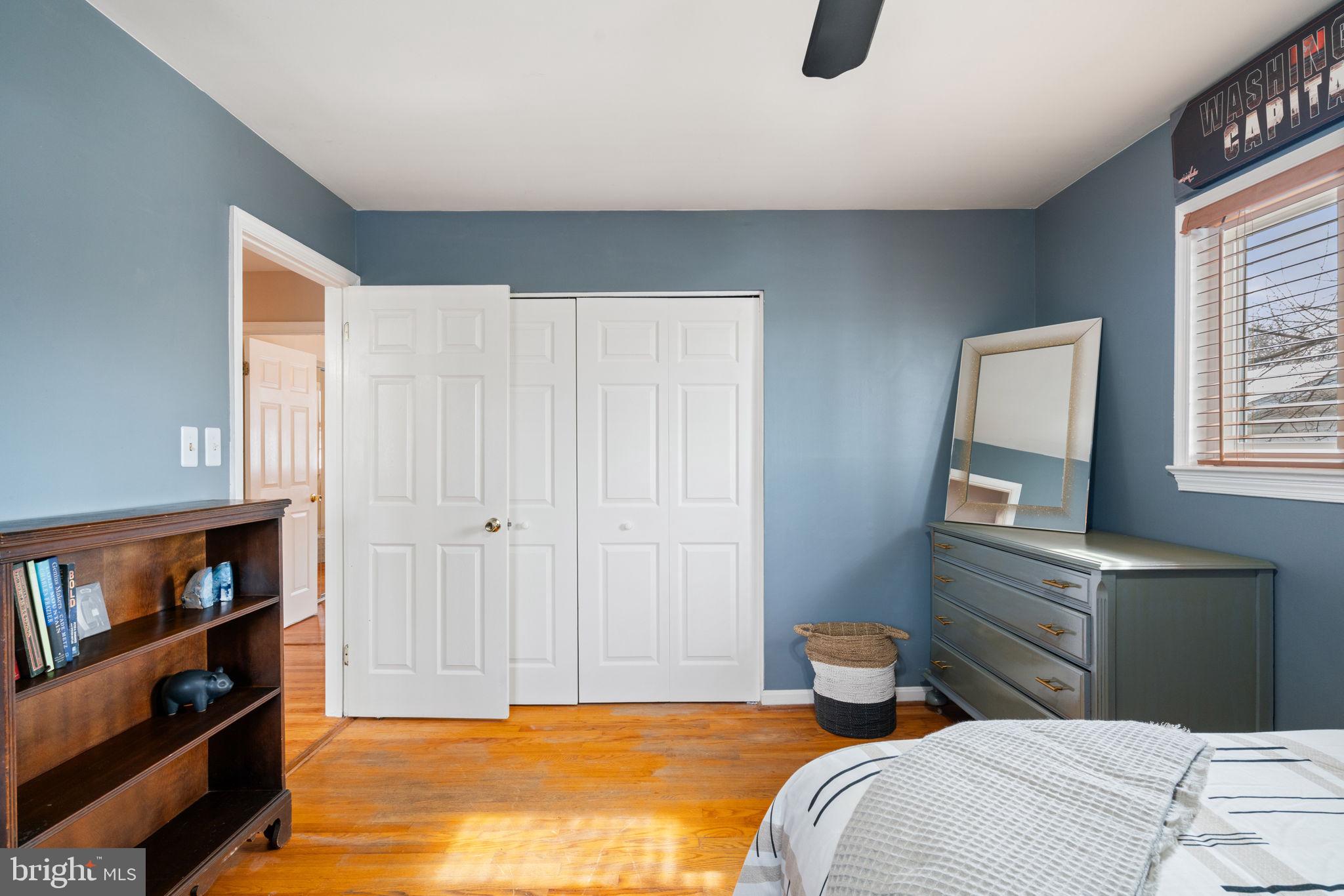 6102 Sherborn Lane Springfield, VA 22152 - Photo 26 of 51 a bedroom with a bed and a book shelf