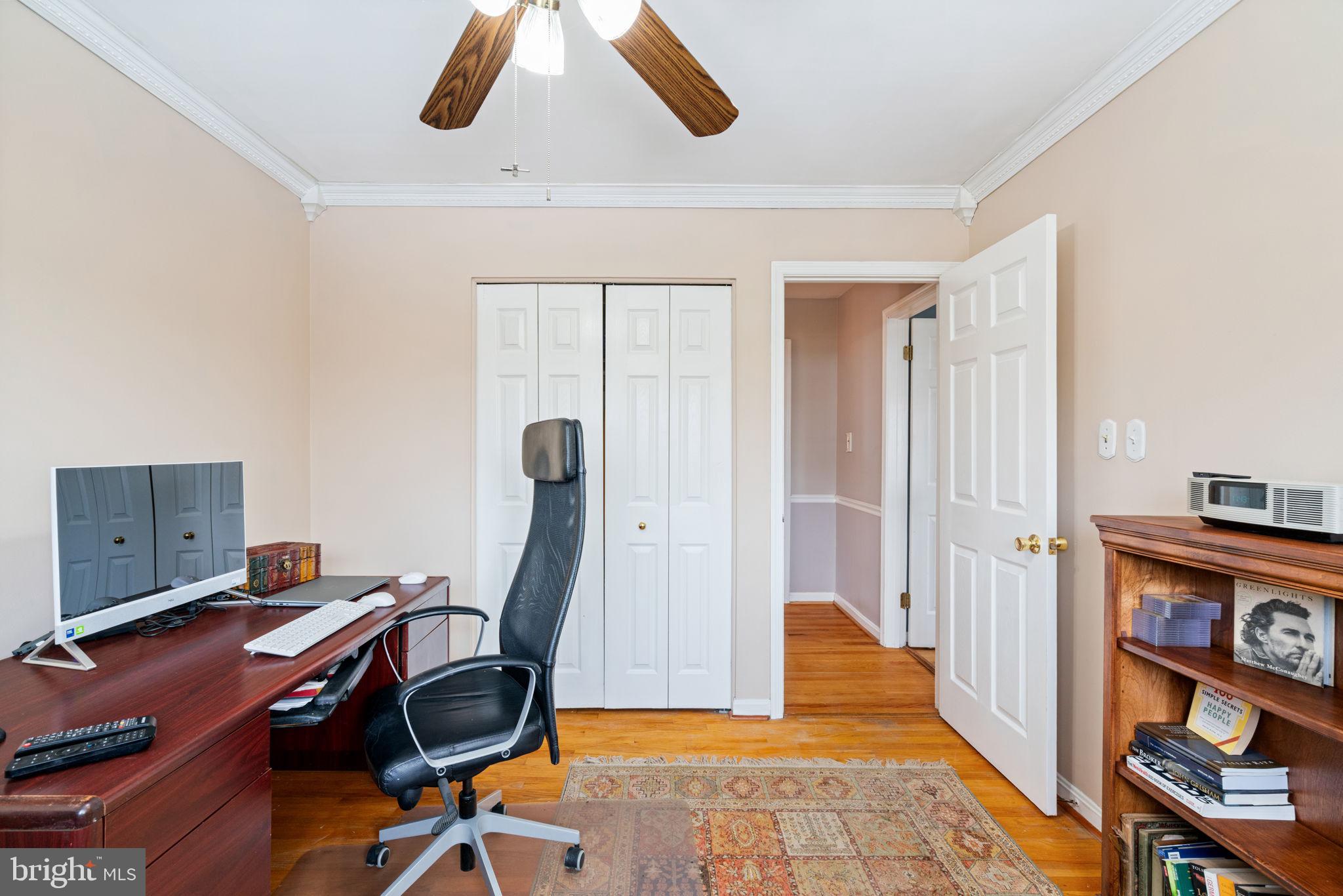 6102 Sherborn Lane Springfield, VA 22152 - Photo 29 of 51 a view of a workspace with furniture and a gate