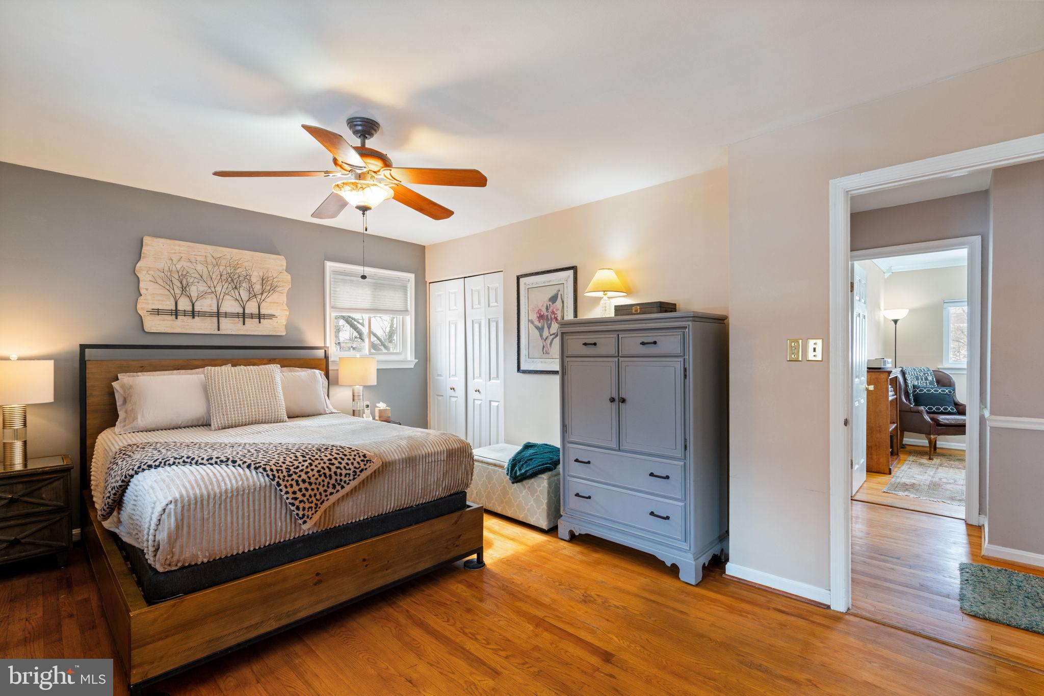 6102 Sherborn Lane Springfield, VA 22152 - Photo 31 of 51 a spacious bedroom with a bed and a chandelier