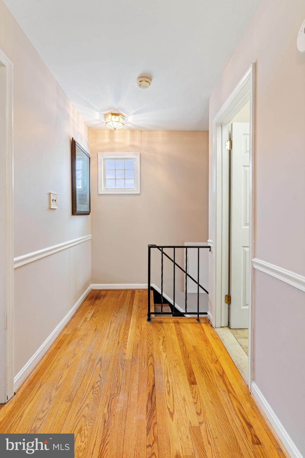 6102 Sherborn Lane Springfield, VA 22152 - Photo 34 of 51 a view of a room with wooden floor and chair