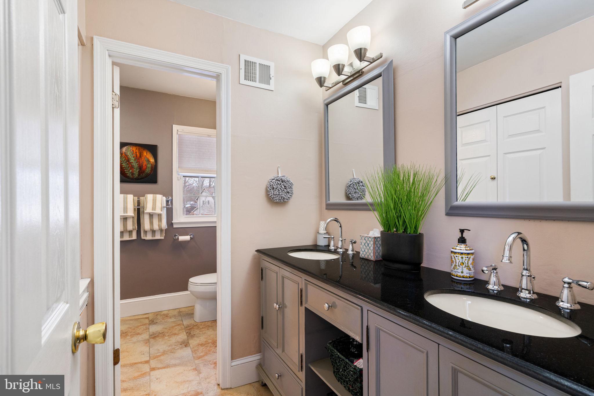 6102 Sherborn Lane Springfield, VA 22152 - Photo 35 of 51 a bathroom with a sink and a mirror