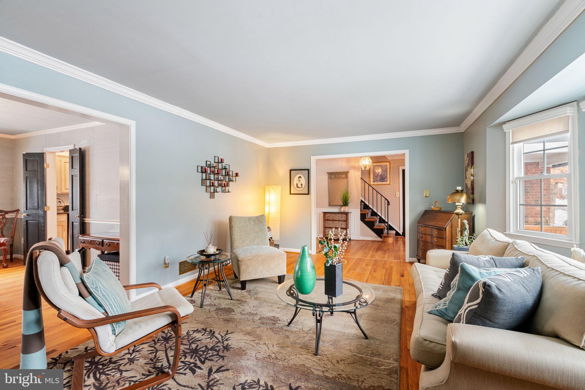 6102 Sherborn Lane Springfield, VA 22152 - Photo 8 of 51 a living room with furniture a rug and a window